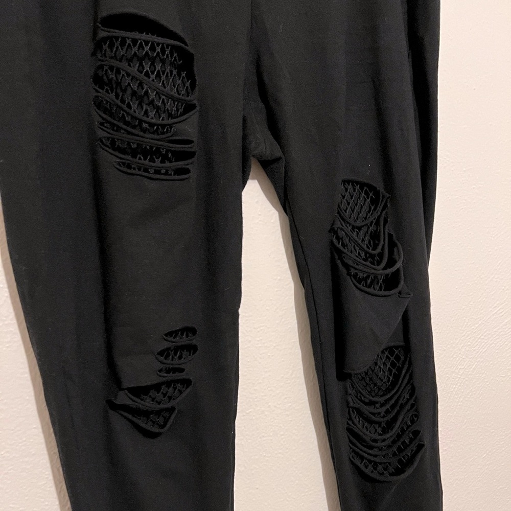Torrid black leggings with fishnets
